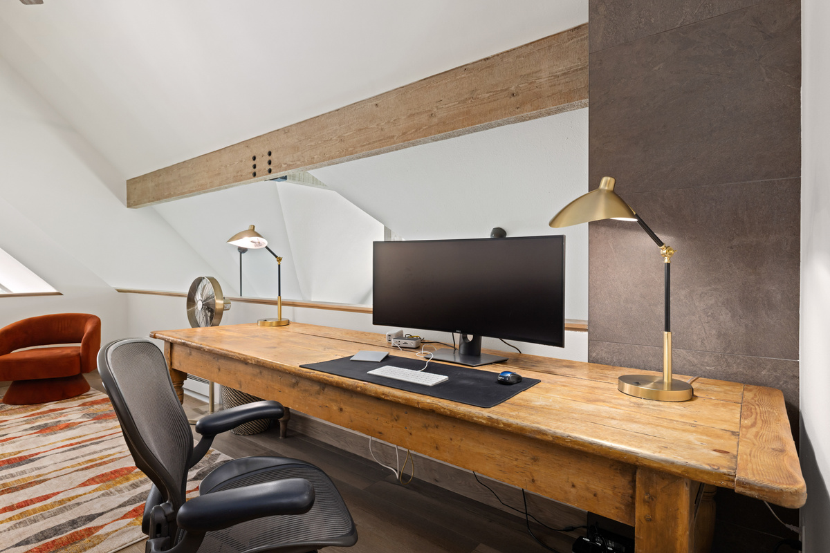 Loft desk with 38 inch monitor, docking station, 2.5gb hardwired ethernet, wireless keyboard, wireless trackpad, wireless mouse, laser printer (located behind desk).
