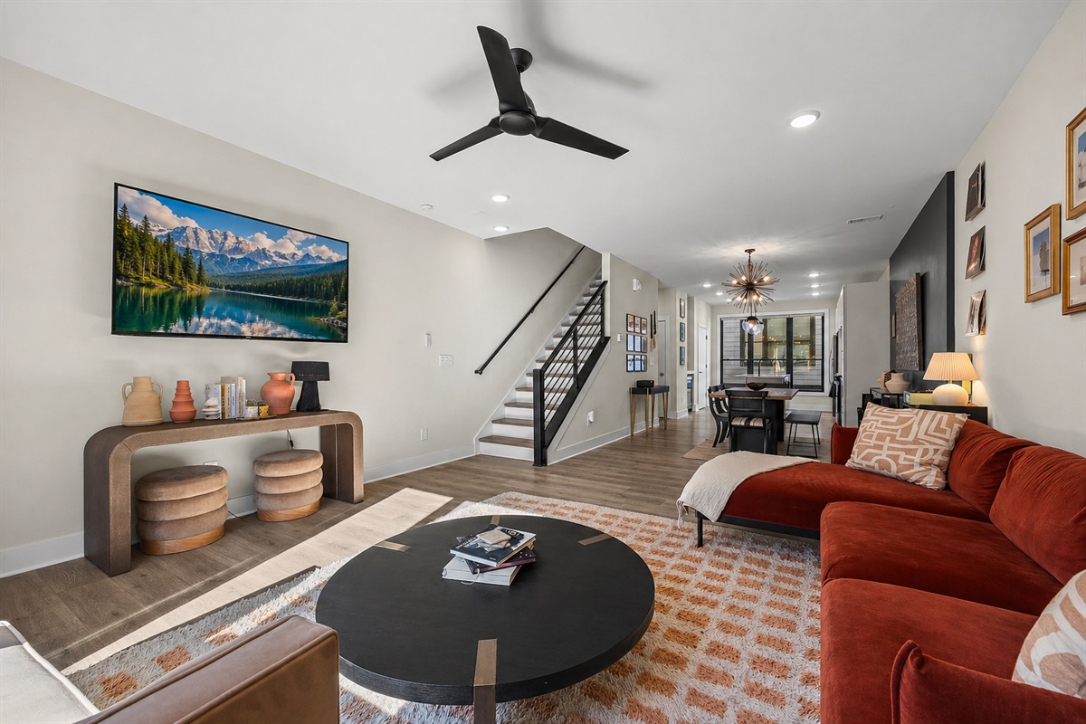 Kick your feet up and watch your favorite show while the rest of your group cooks in the kitchen or makes a craft cocktail at the cocktail bar. This living room is made for cozy group gatherings and deep, cool relaxation. 