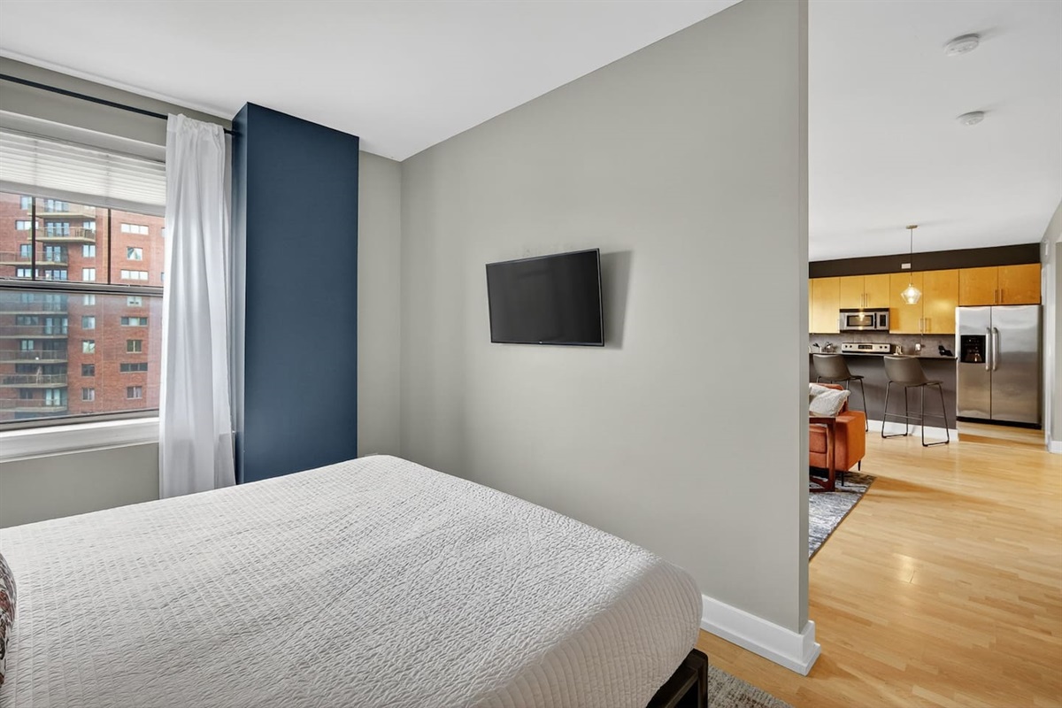 Enjoy a bright, airy bedroom that flows directly into the living and kitchen areas. City views, smart design, and modern comforts create a welcoming space to rest, recharge, and feel at home in the heart of Des Moines.