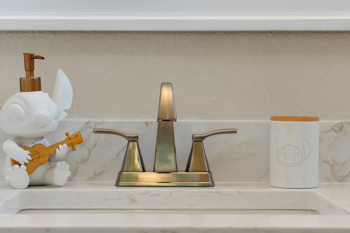 Stitch Queen Retreat Ensuite: Playful Stitch-inspired bathroom accessories add a touch of island charm to the renovated ensuite.