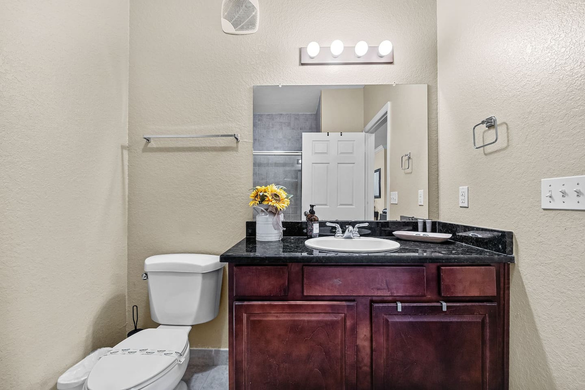 Sleek bathroom vanity, in bathroom 2, with beautiful accents.