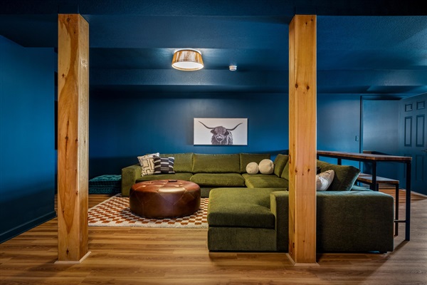 Stretch out on the sectional or floor cushions—this is where movies, games, and late-night conversations come together.