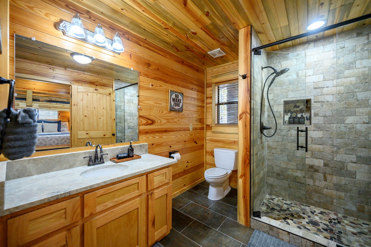 Full bathroom with walk-in tile shower 🚿 Clean, spacious, and stocked for your stay.
