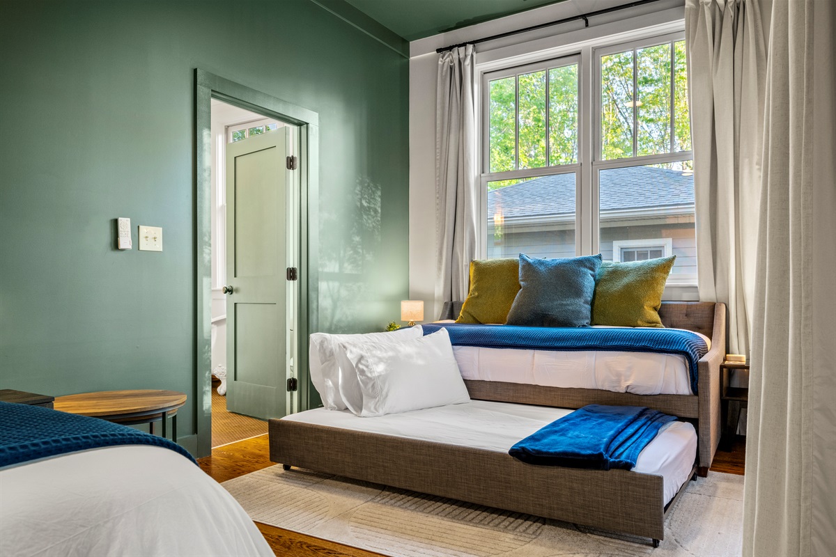 The hidden twin trundle pulls out smoothly for extra sleeping space—perfect for kids, cousins, or close friends who want to share the same spacious room. 