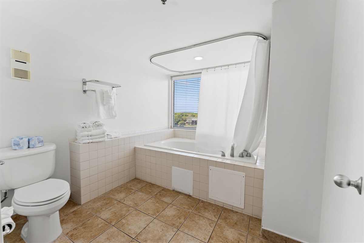 Main Bathroom with large soaker tub and shower