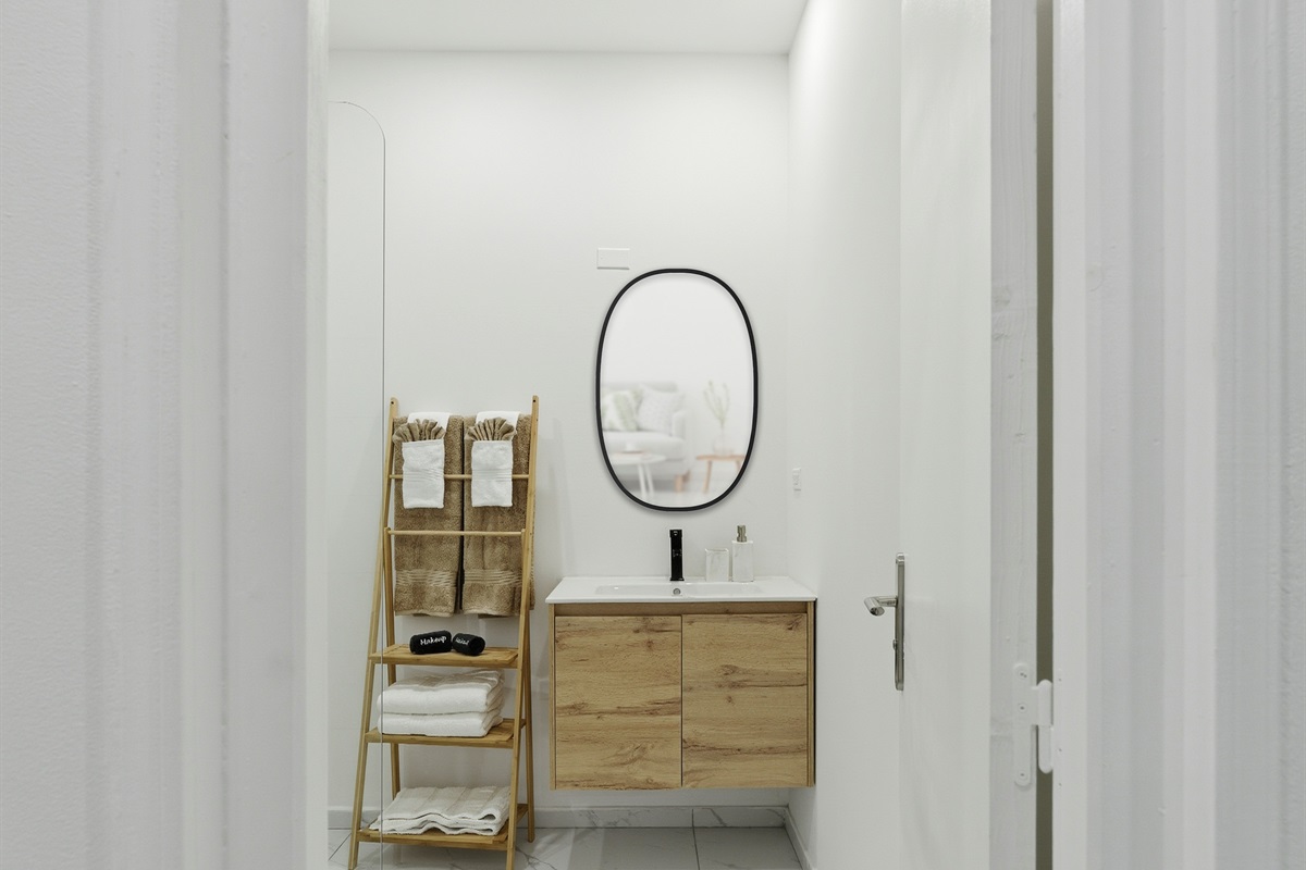 Elegant en-suite bathroom with modern fixtures and bright lighting