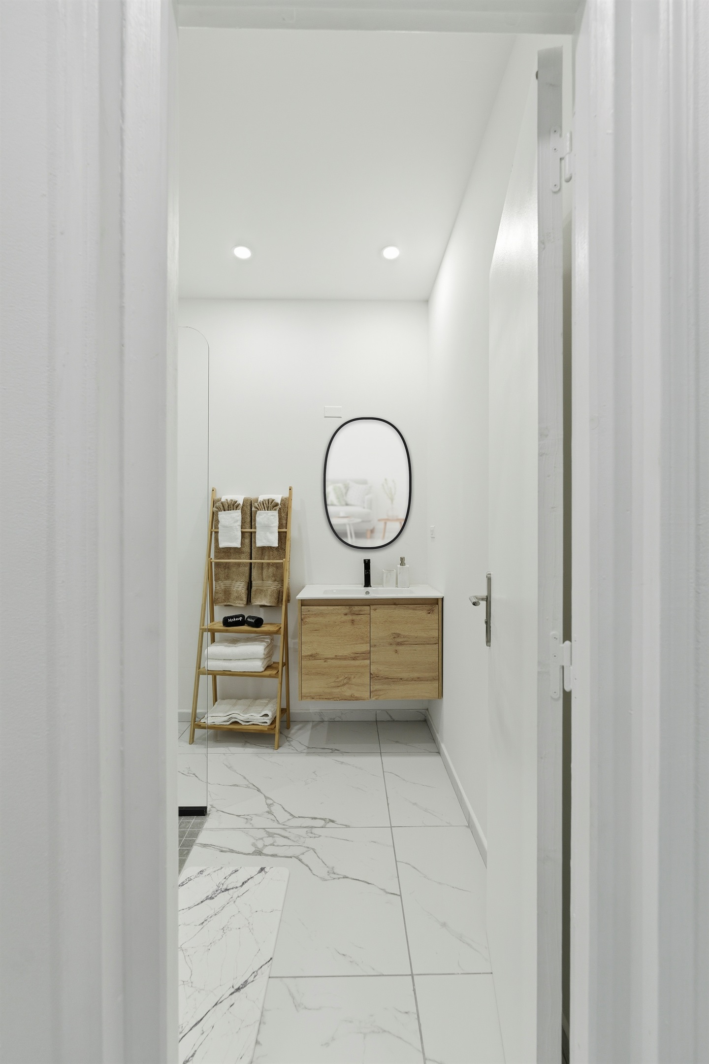 Elegant en-suite bathroom with modern fixtures and bright lighting