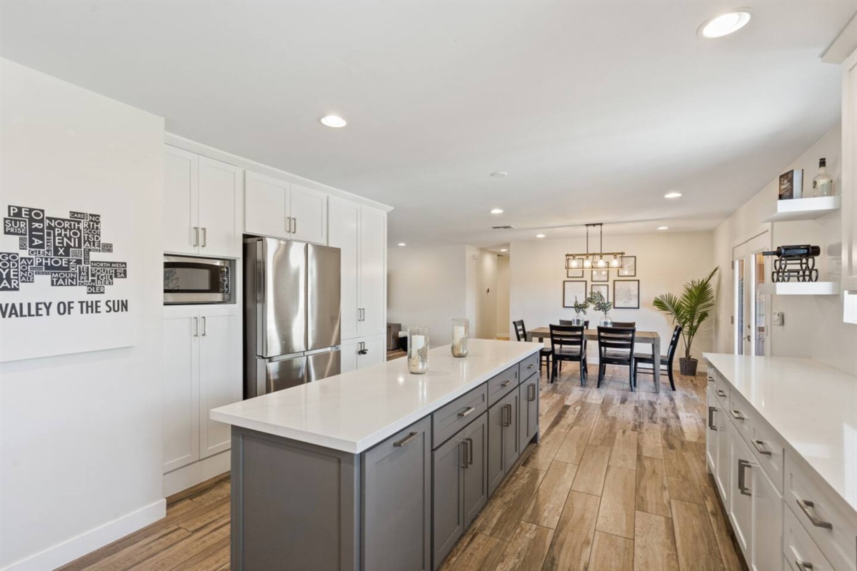 Full kitchen with large island, plenty of storage, and easy access to the dining and living areas.
