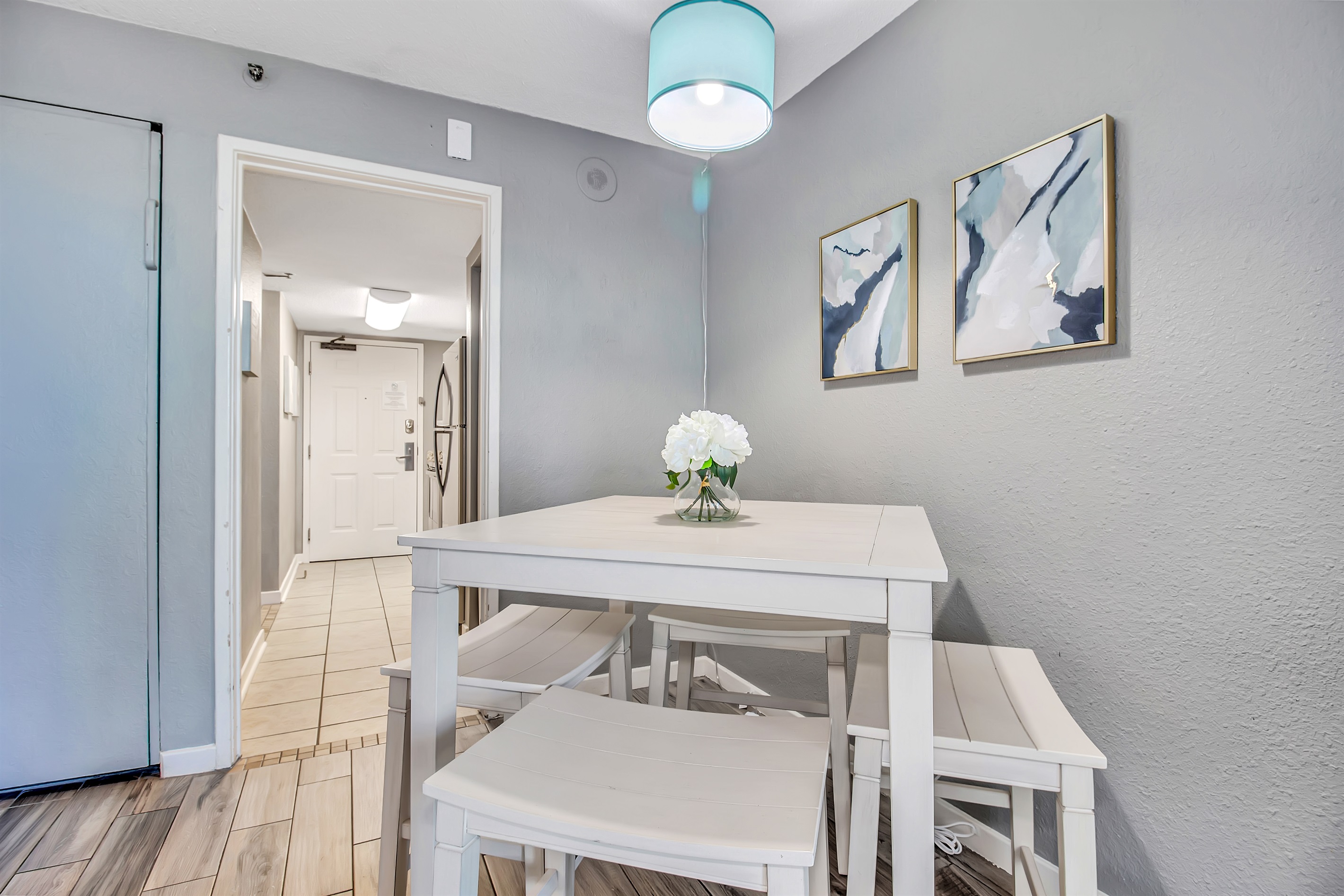 Experience casual elegance in our suite's dining space, where a laid-back atmosphere meets sophisticated design for a comfortable yet refined meal.