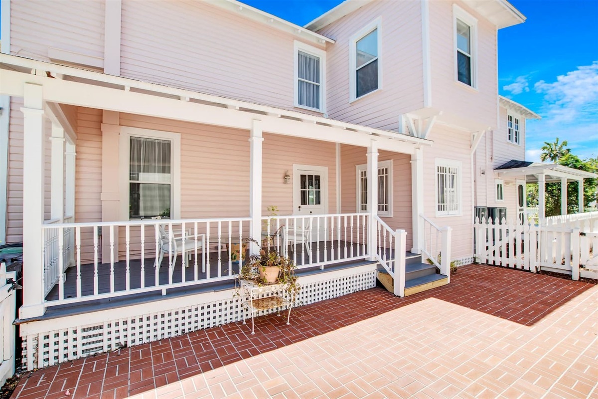 Side porch with brick courtyard