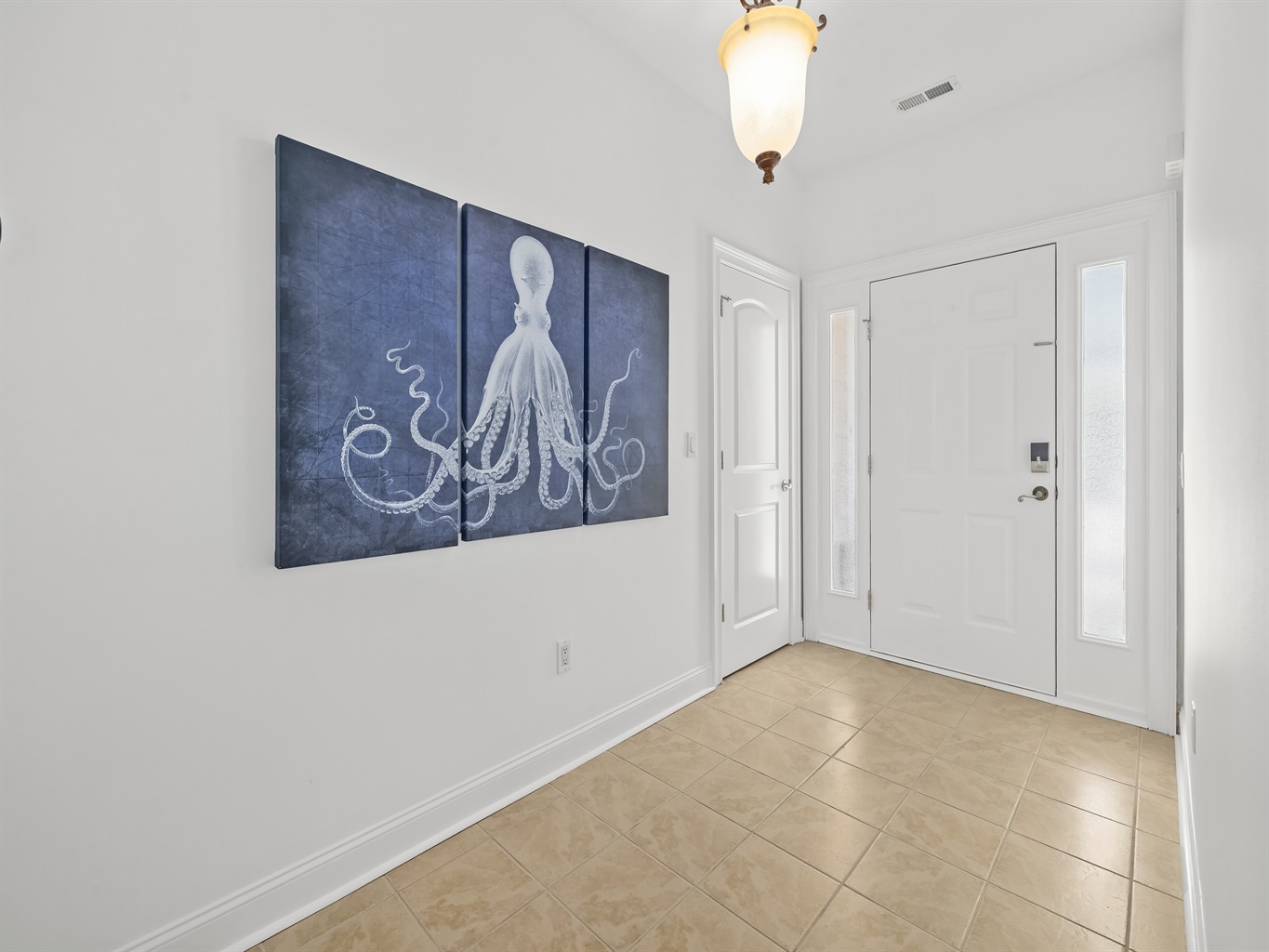 Simple, clean, and welcoming entryway sets the tone the moment you arrive — open, uncluttered, and designed for an easy transition from travel mode to vacation relaxation.