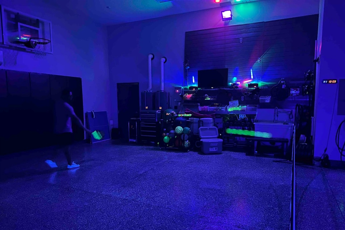 Glow in the dark pickleball court inside garage, we have the court lines as well.