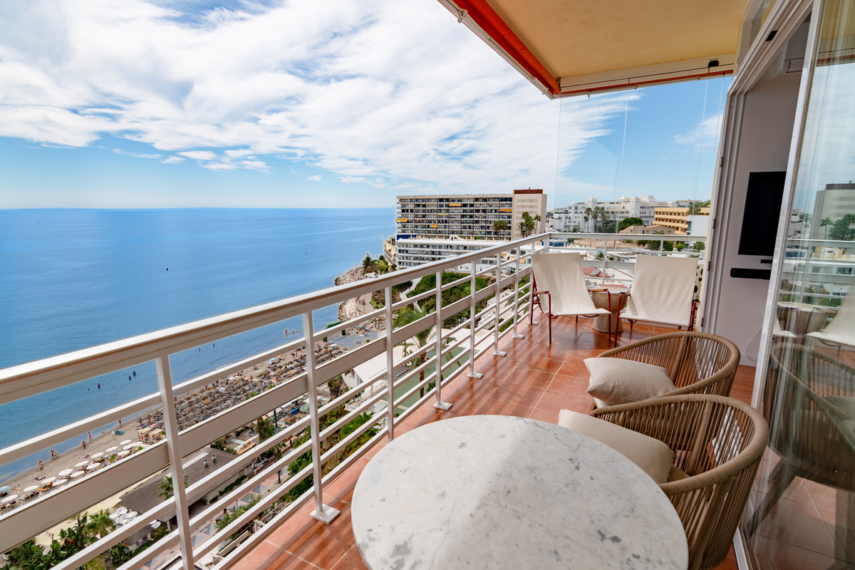 Long balcony with room to sit, dine, and enjoy the view