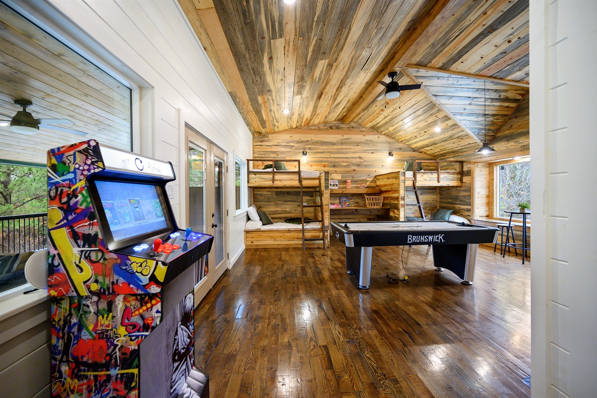 Upstairs game room and bunk loft at Hit Refresh feels like every kid’s drea
Arcade battles, late night air hockey tournaments, cozy bunk room sleepovers, and the kind of laughter that carries long after the trip is over. 