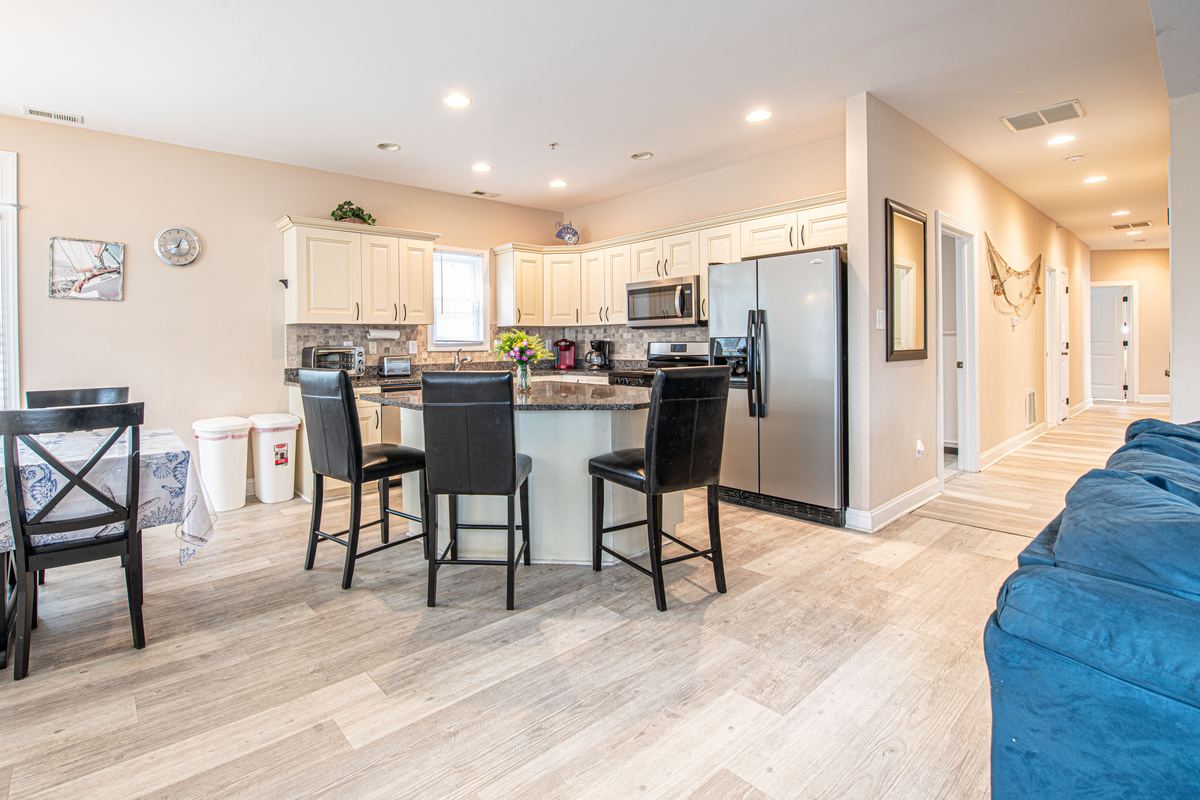 Kitchen Island, Dining Area, and Living Room Corner