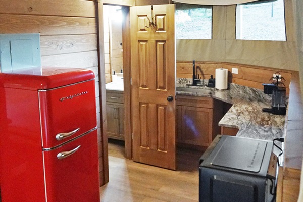 Gourmet Kitchenette: Vintage red fridge and modern amenities create a fun cooking vibe!