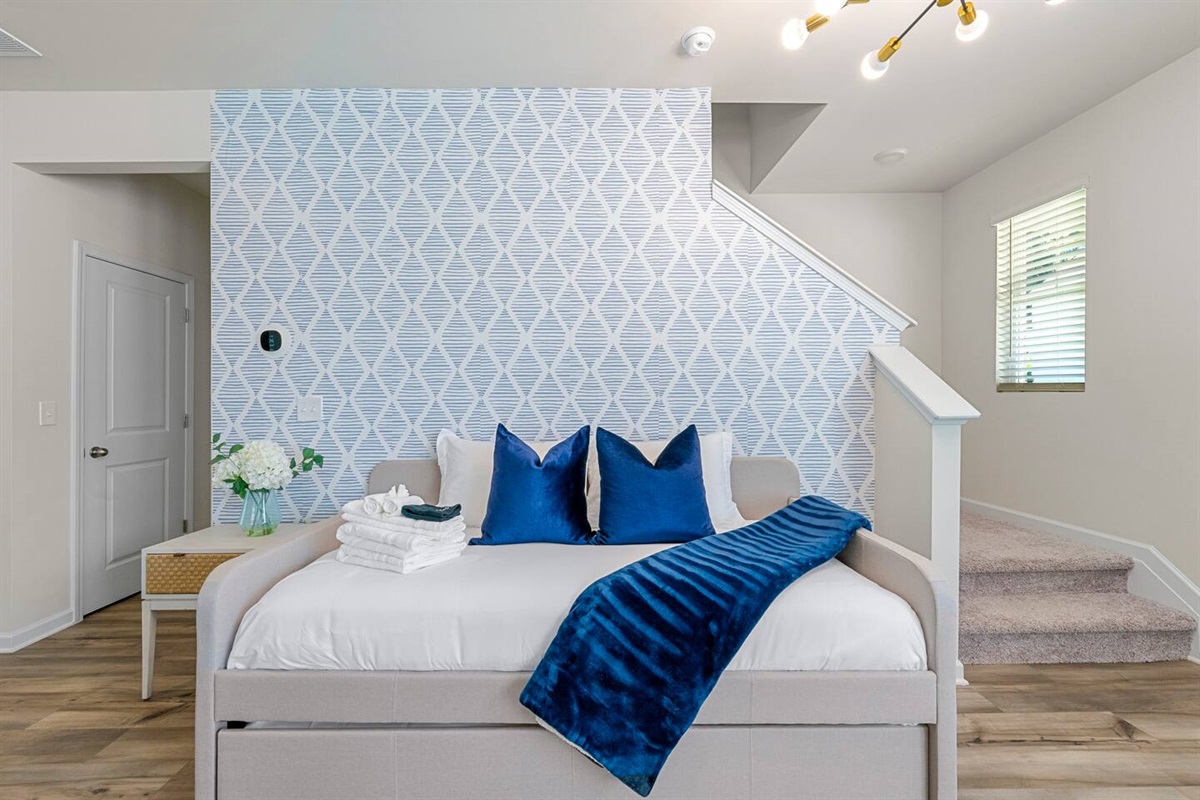 Daybed with twin bed on top and twin trundle bed underneath.