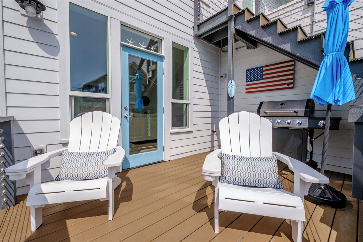 A charming deck on the main level with grill, and Adirondack seating, perfect for quiet mornings, sipping coffee, or evening conversations. 