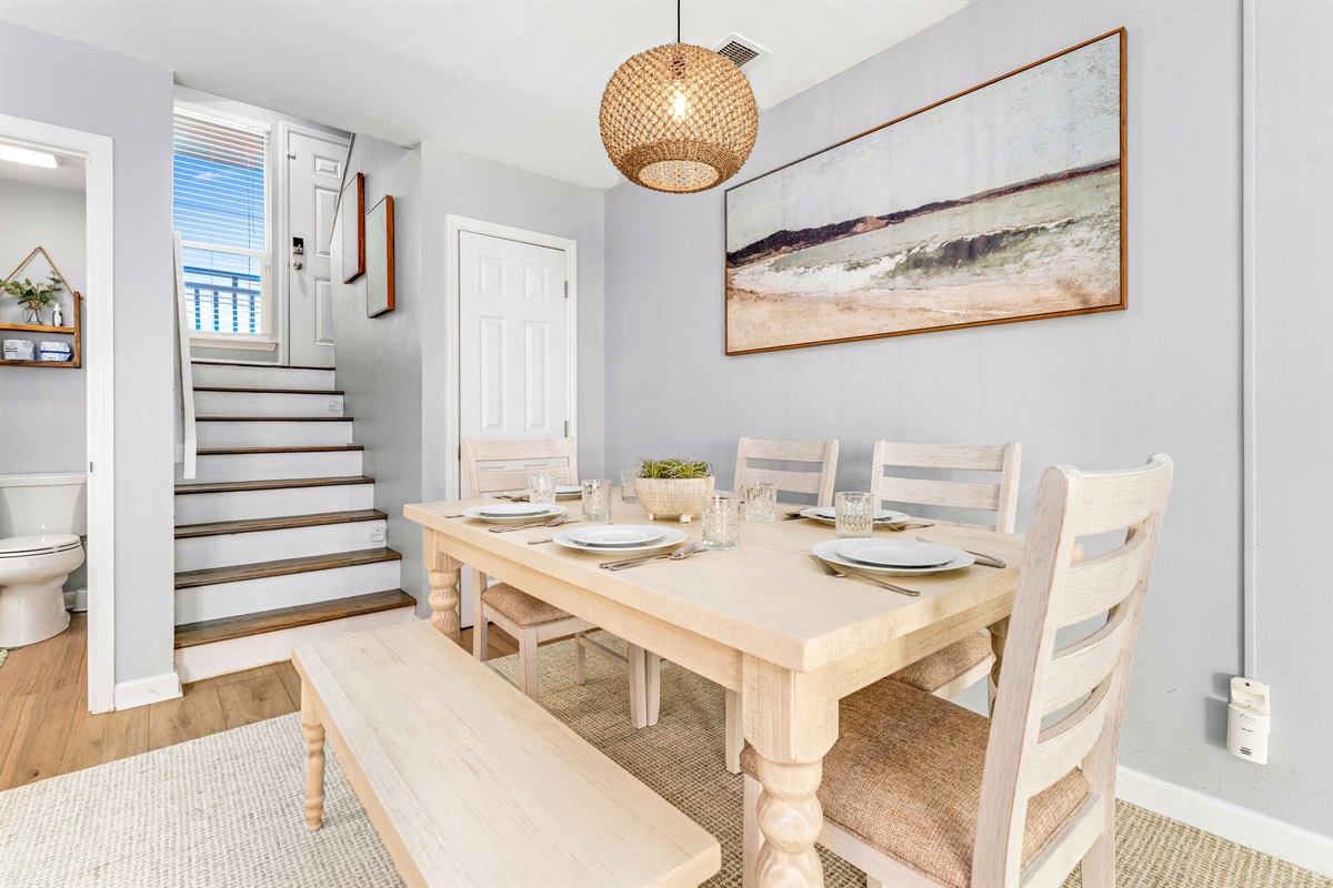 The dining table seats six, providing ample space for family meals and gatherings.