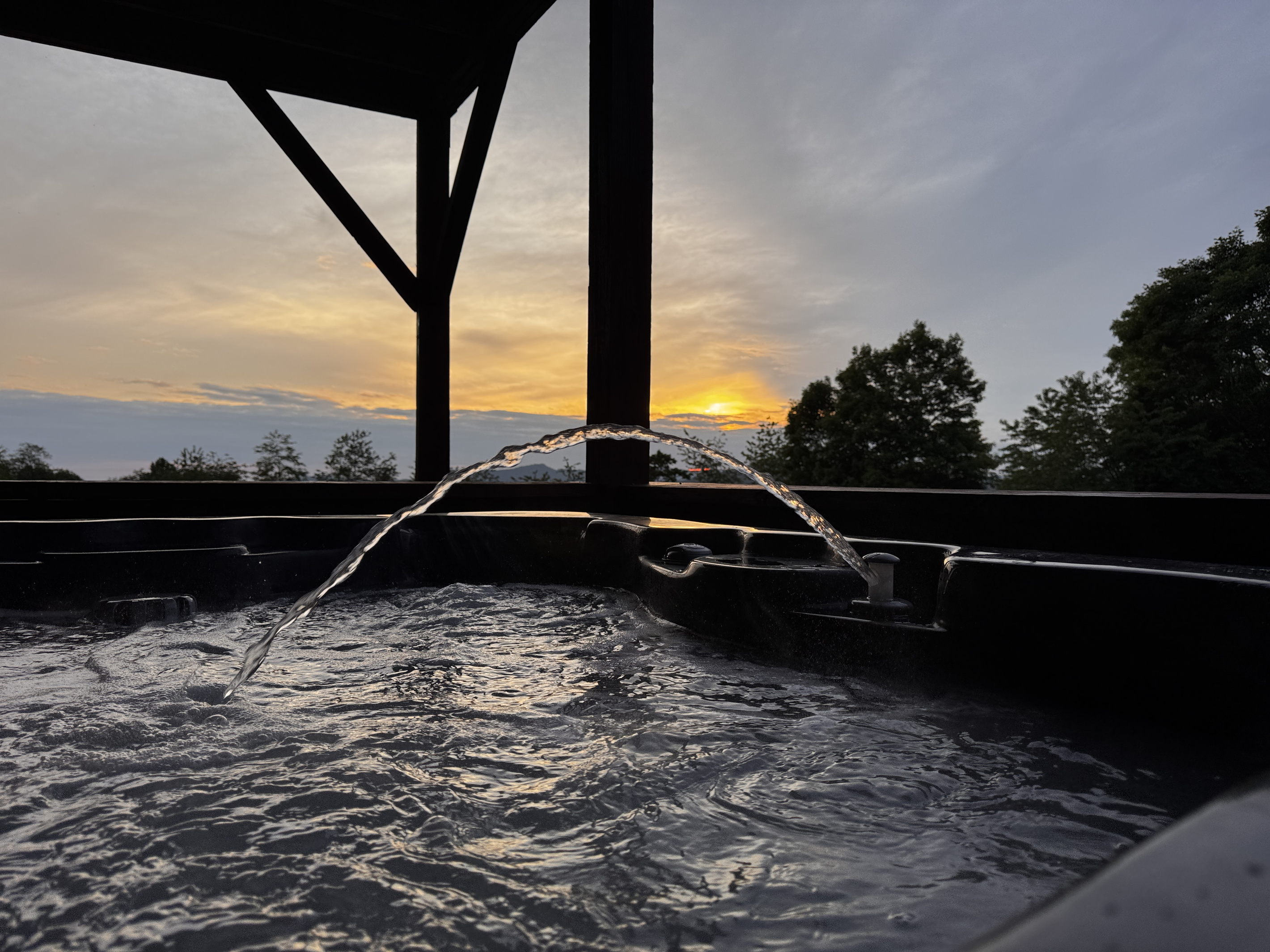 Private outdoor hot tub provides a relaxing retreat after hiking, mountain biking, skiing or exploring Western North Carolina.