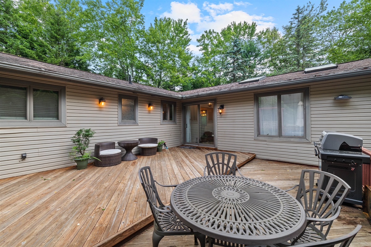 Spacious deck with grill and outdoor dining—perfect for cookouts and gatherings