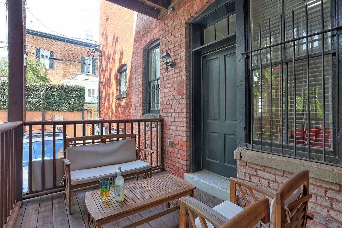 Enjoy fresh air and Savannah views from this charming bedroom-side porch.