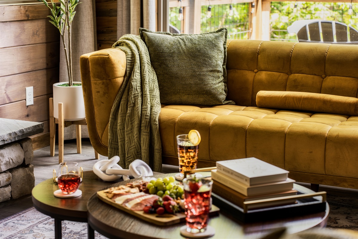 Stylish living room with plush seating & electric fireplace, perfect for family time
