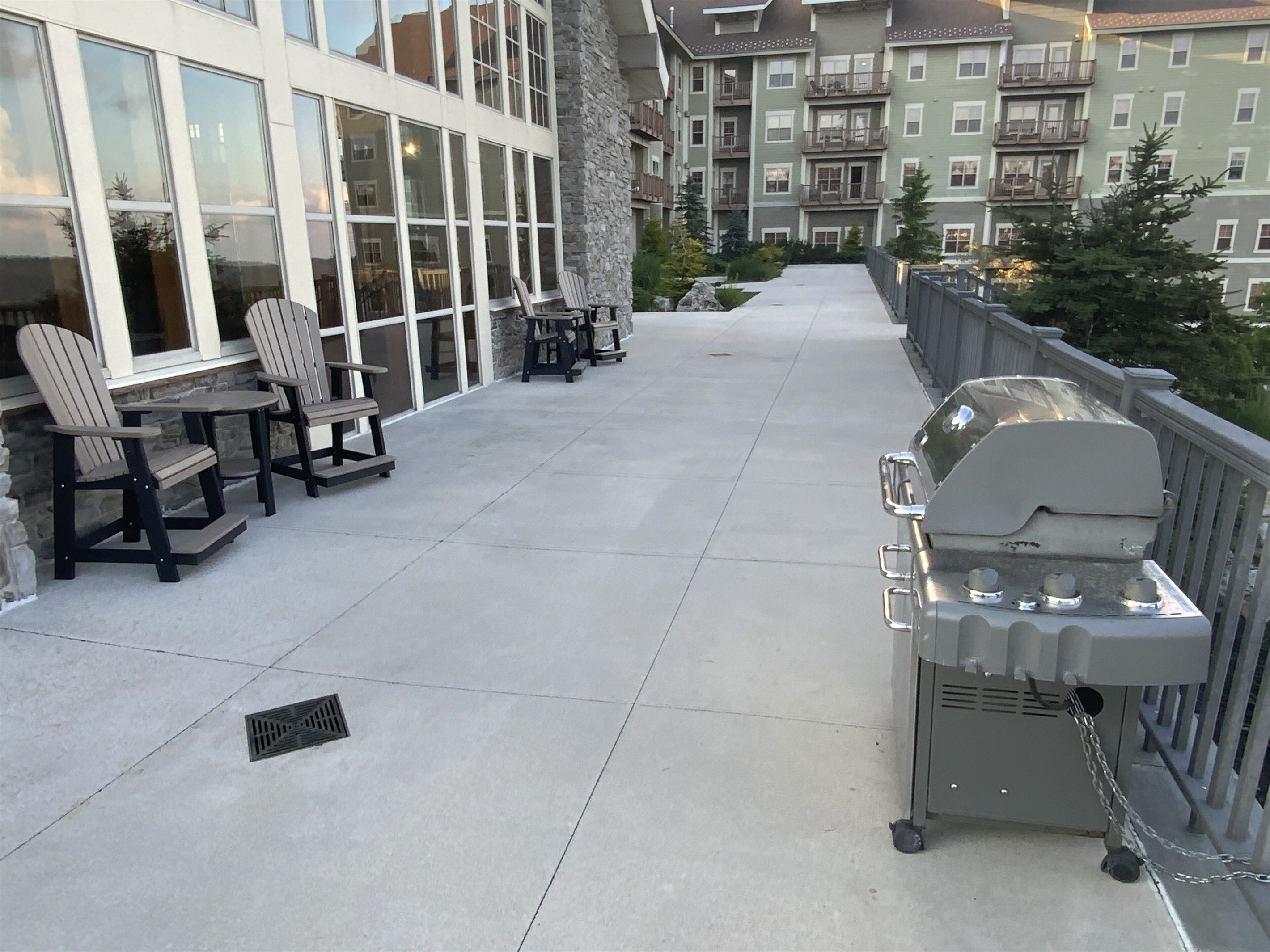Large deck with gas grill and seating outside of "The Hearth Room