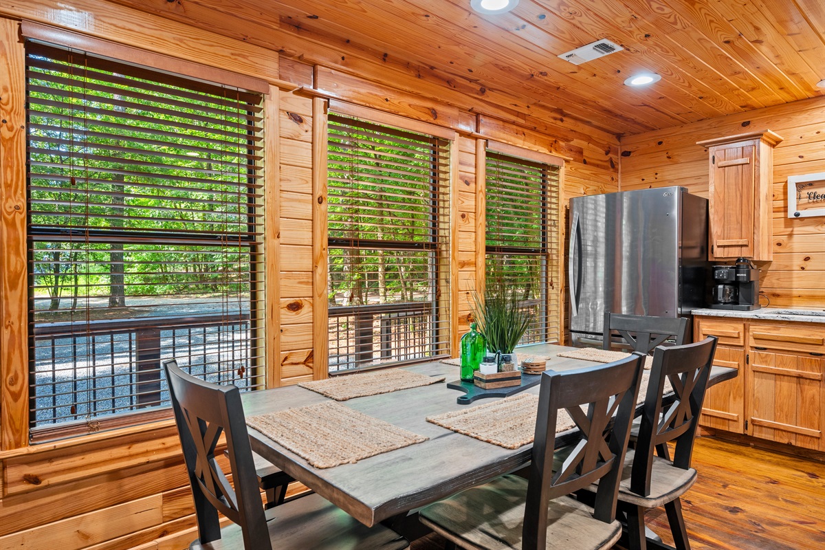 Cozy dining nook with large windows that offer peaceful woodland views while you eat or sip your morning coffee.