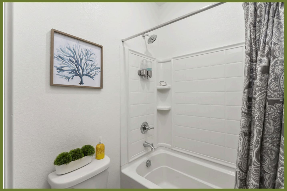 Bathroom with shower/tub combination,  and clean essentials for daily routines.