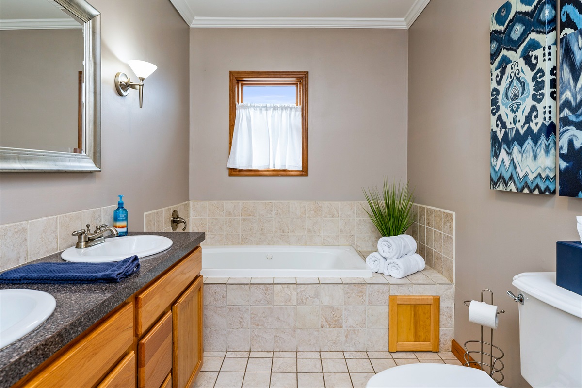 Master bathroom with jet tub and walk in shower