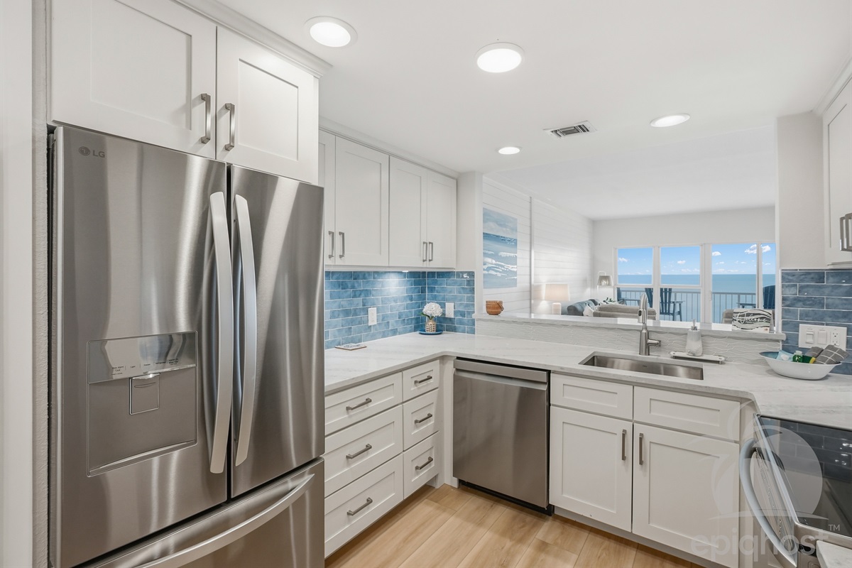 Open kitchen with stainless appliances