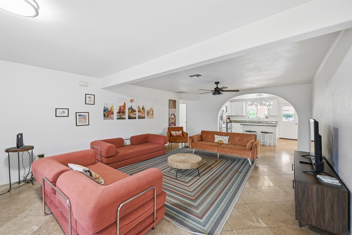 Gather in the cozy living room, where stories flow and movie nights stretch into late laughs 🧡✨