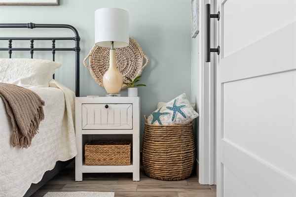The oversized basket is the perfect place to store decorative pillows at night