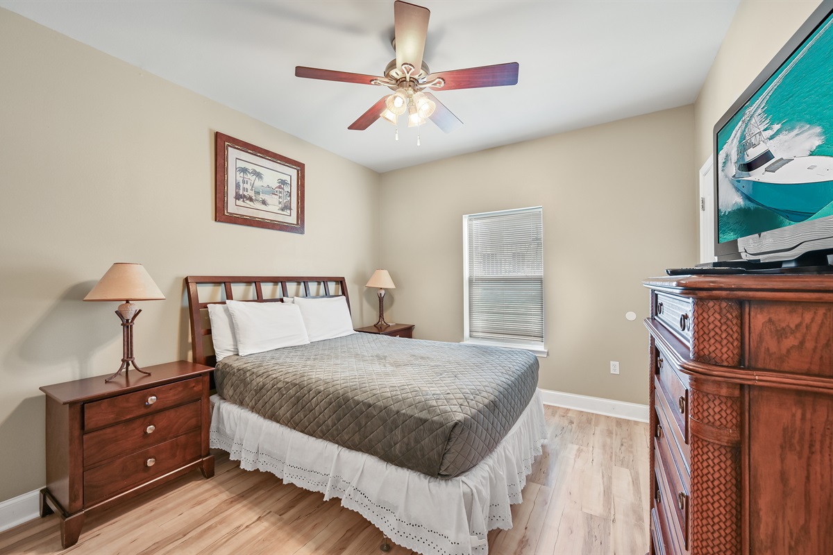 BEDROOM #5 + BATHROOM #5: Queen Bed with night stands, dresser, and TV. This bedroom has a private b