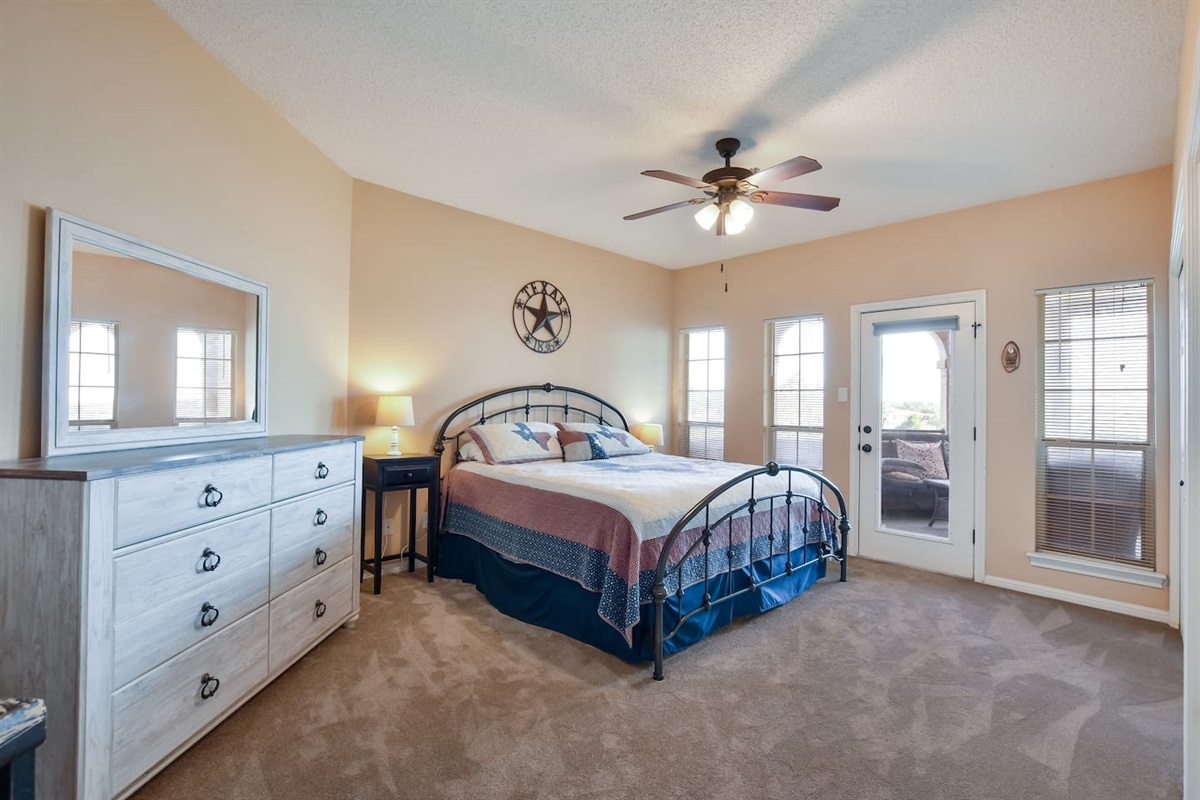 King Bed in Primary Bedroom with Patio Access