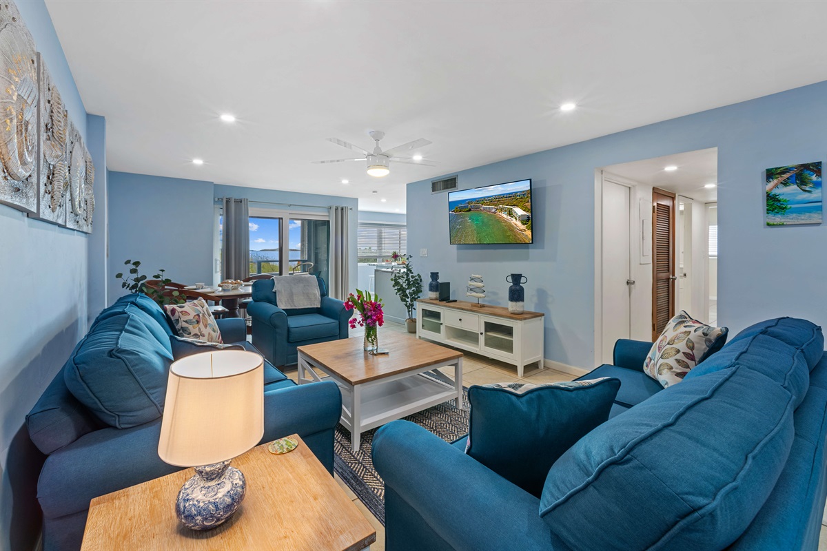 Enjoy the large living room with Smart TV and plenty of seating for movie nights