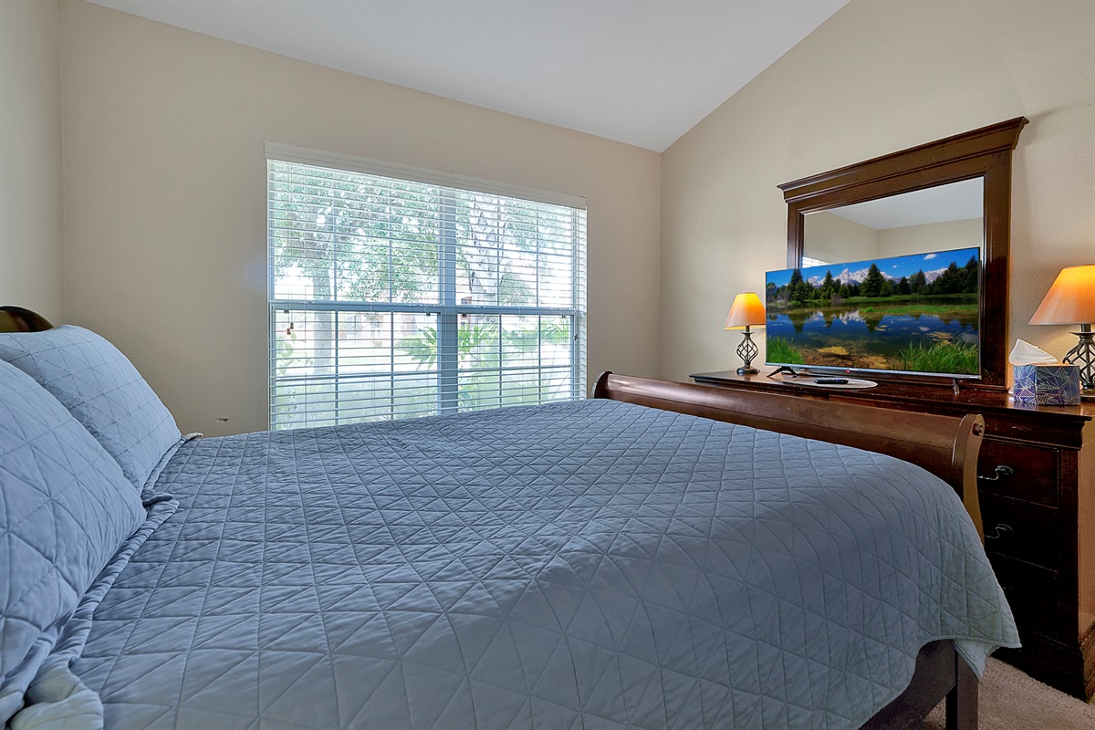 Skip the stairs: This accessible ground-floor second bedroom offers a queen-size bed and is located just steps from a full bathroom 