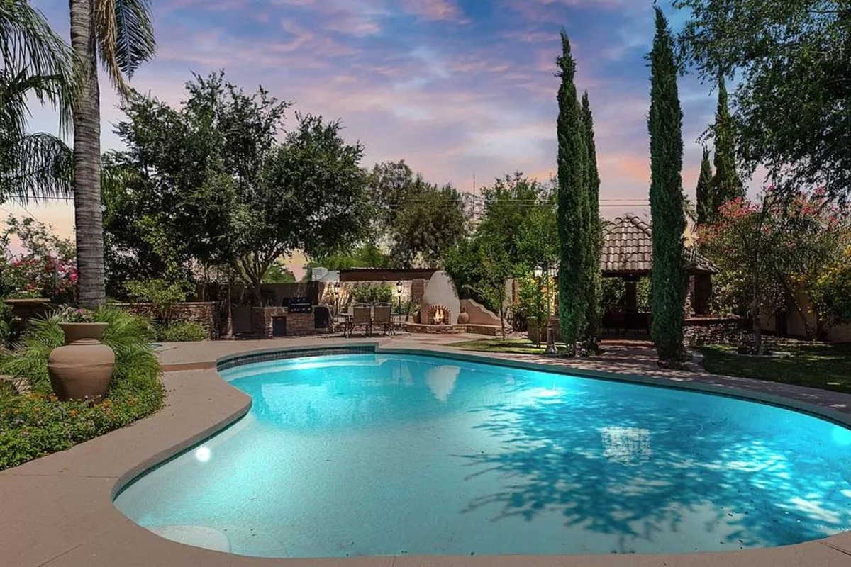 Escape to your heated pool, surrounded by peaceful trees, and indulge in ultimate relaxation.