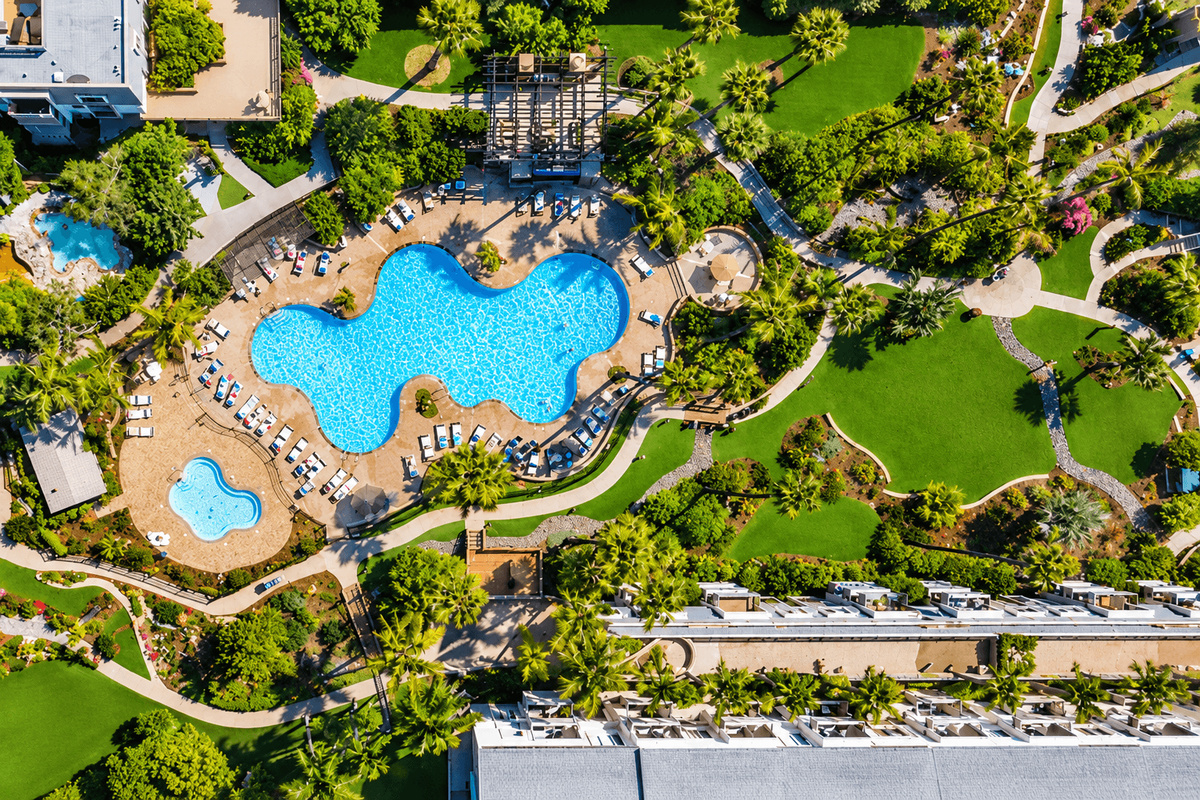 Main pool, two hot tubs, and a seven-hole putting green