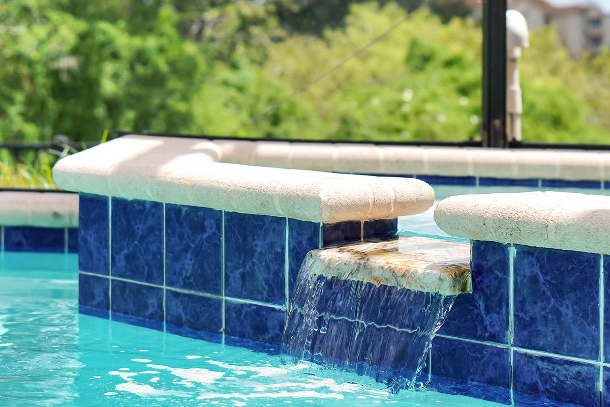 Private Spa: Relax in the private spa with a soothing spillover waterfall into the pool.
