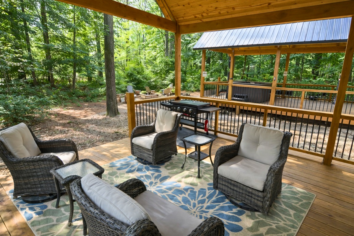 Relax and unwind on the deck with cozy seating and a perfect grill setup