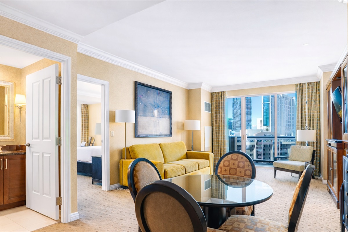 Spacious living area with queen sofa bed and direct balcony access 🛋️