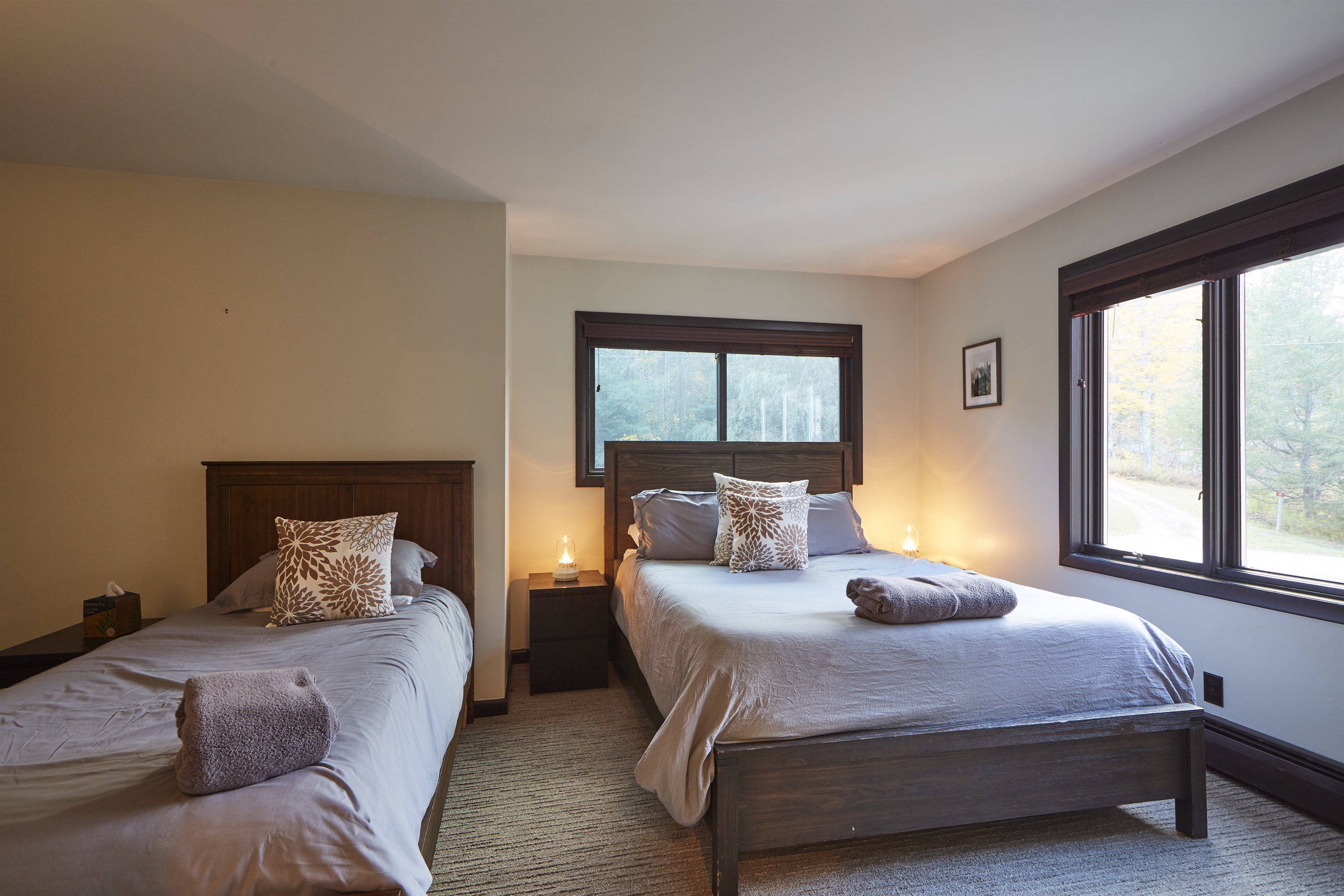 This second floor bedroom, one of three, has two beds.