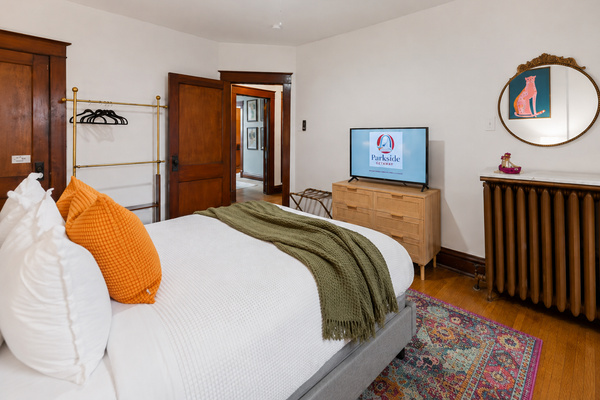 Tuck guests into the second bedroom's queen bed, with a bonus room attached for extra space.