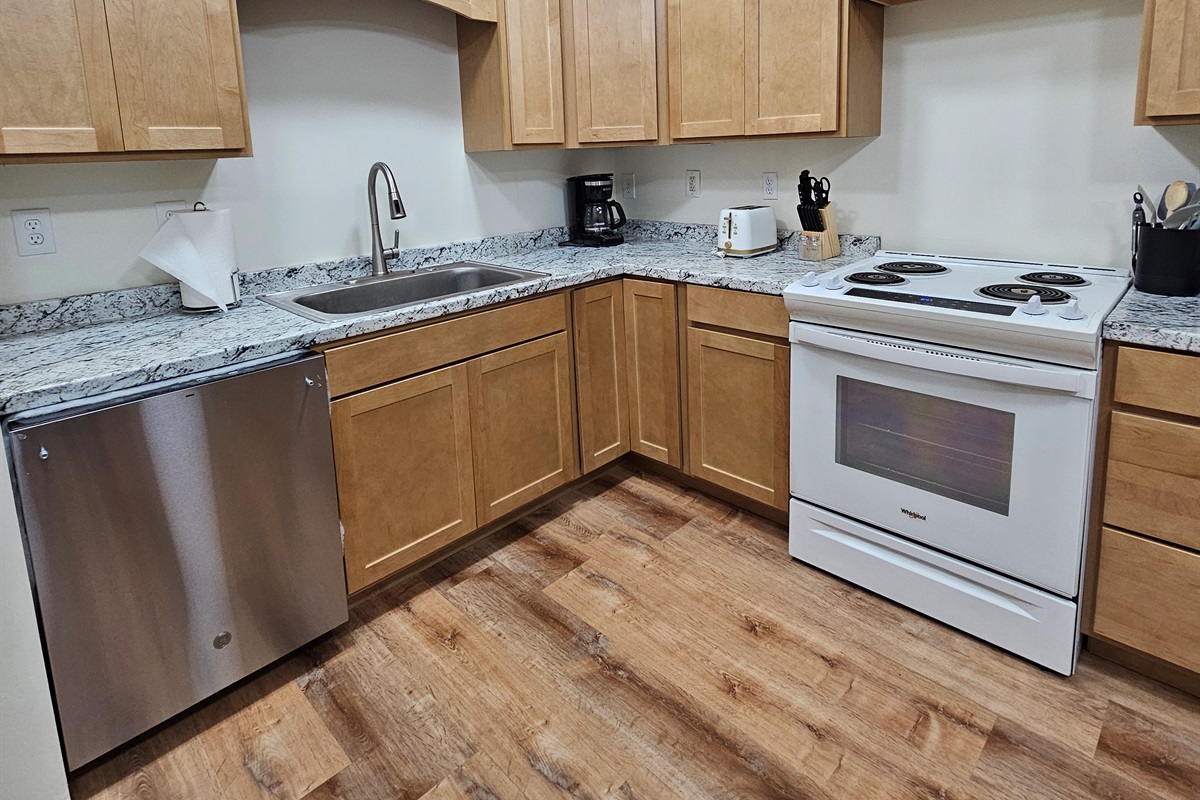 Full Kitchen with Dishwasher, Stove, and Refrigerator