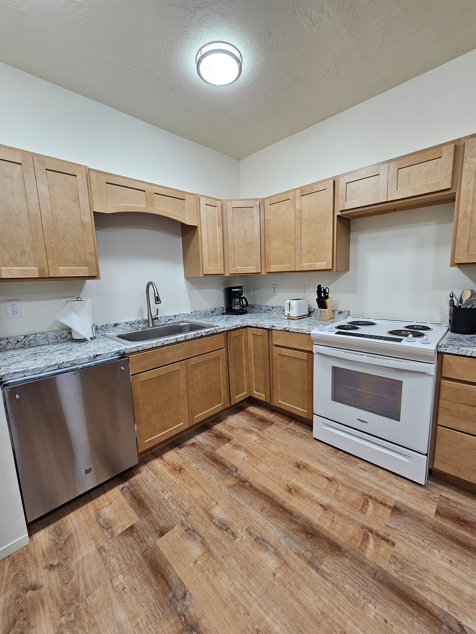 Full Kitchen with Dishwasher, Stove, and Refrigerator