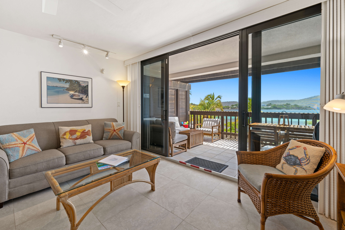 Bright, open living area with comfortable furnishings and a true island feel.
