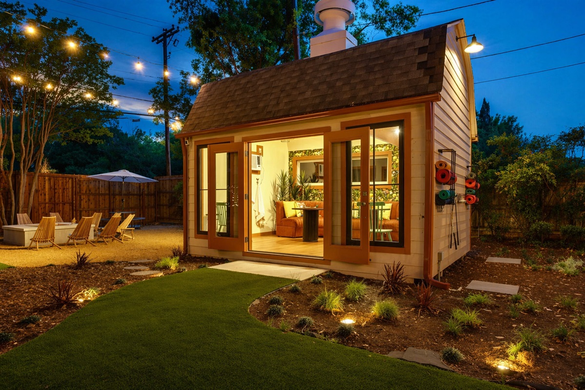 Private pool house with lounge seating, yoga mats and French doors opening to the backyard. Fort Worth vacation rental with amenities built for groups who want more than just a place to sleep.