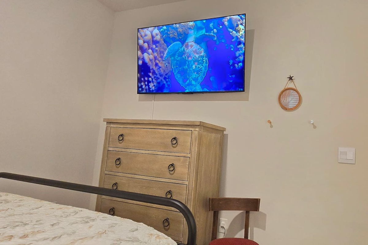 Large screen Google Smart TV and plenty of storage in the Queen Bedroom One 